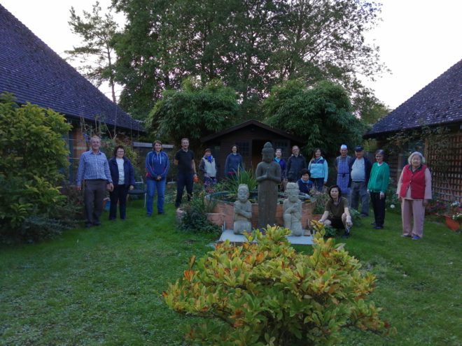 men and women helping in garden