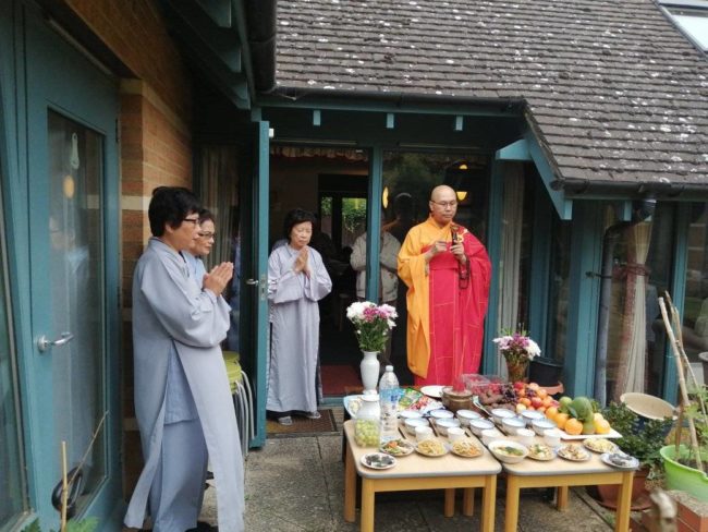 Monk in orange and red robes
